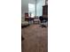 Bedroom with neutral carpet and various chairs and tables at 1877 Dragonfly Ave, North Port, FL 34288