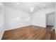 Bright bedroom with hardwood floors, white walls, and a chandelier at 2326 Gull Ln, Sarasota, FL 34237