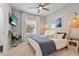 Spacious main bedroom with a king-size bed and calming decor at 2724 Butterfly Jasmine Trl, Sarasota, FL 34240