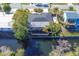 House on canal with deck and lush landscaping at 2961 Homasassa Rd, Sarasota, FL 34239