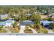 House on a canal with a large backyard and tropical landscaping at 2961 Homasassa Rd, Sarasota, FL 34239