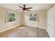 Bright bedroom with tile floors, ceiling fan, and double closets at 2961 Homasassa Rd, Sarasota, FL 34239