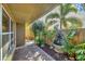 Private courtyard with a tranquil fountain and lush greenery at 2961 Homasassa Rd, Sarasota, FL 34239