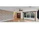 Elegant entryway features a brick accent wall and tile floors at 2961 Homasassa Rd, Sarasota, FL 34239