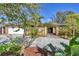 Inviting home exterior features lush landscaping and a paved driveway at 2961 Homasassa Rd, Sarasota, FL 34239