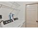 Convenient laundry room with washer, dryer, and shelving at 2961 Homasassa Rd, Sarasota, FL 34239