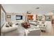 Open living room and kitchen with tile floors and lots of natural light at 2961 Homasassa Rd, Sarasota, FL 34239