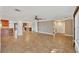 Open concept living space with tile floors and access to the kitchen at 2961 Homasassa Rd, Sarasota, FL 34239