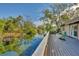 Spacious deck boasts tranquil canal views; ideal for outdoor entertaining at 2961 Homasassa Rd, Sarasota, FL 34239