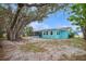 View of the home's exterior and backyard at 300 Coral Rd, Venice, FL 34293