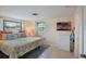 Bedroom with king-size bed, dresser and beach artwork at 300 Coral Rd, Venice, FL 34293