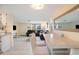 Kitchen and dining area with white table and view of living room at 300 Coral Rd, Venice, FL 34293