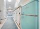 Retro kitchen with teal refrigerator and white cabinets at 300 Coral Rd, Venice, FL 34293