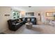 Living room with comfortable sectional sofa and view into dining area at 300 Coral Rd, Venice, FL 34293