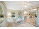 Bright sunroom with glass doors opening to the kitchen and backyard at 300 Coral Rd, Venice, FL 34293