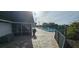 Community pool with lounge chairs and patio area at 3935 Panola Ln # 183, Sarasota, FL 34232