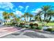 Gated community entrance, showcasing palm trees and lush landscaping at 4136 Via Mirada, Sarasota, FL 34238