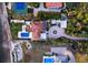 Luxury waterfront estate with a tennis court, a pool, and lush landscaping at 4311 Bay Shore Rd, Sarasota, FL 34234