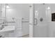 This bathroom has a glass shower and sink with subway tile and black accents at 4311 Bay Shore Rd, Sarasota, FL 34234