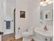 Classic bathroom with pedestal sink, terracotta tile floor and walk-in shower at 4311 Bay Shore Rd, Sarasota, FL 34234