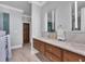 A double sink bathroom vanity has marble countertops and wood cabinets at 4311 Bay Shore Rd, Sarasota, FL 34234
