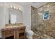Elegant bathroom featuring a granite vanity and a glass-enclosed stone shower at 4311 Bay Shore Rd, Sarasota, FL 34234