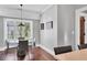 Dining room with modern lighting, large windows, and hardwood floors at 4311 Bay Shore Rd, Sarasota, FL 34234