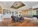 Spacious dining room featuring hardwood floors, built in bookcase, and unique ceiling design at 4311 Bay Shore Rd, Sarasota, FL 34234