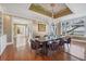 Elegant dining room with a decorative ceiling, chandelier, and gorgeous ocean view at 4311 Bay Shore Rd, Sarasota, FL 34234