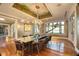 Formal dining room featuring hardwood floors, chandelier lighting, and beautiful ceiling artwork at 4311 Bay Shore Rd, Sarasota, FL 34234
