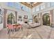 Light-filled living room with soaring ceilings, large windows, fireplace, and comfortable seating at 4311 Bay Shore Rd, Sarasota, FL 34234
