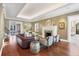 Spacious living room with hardwood floors, fireplace, comfortable seating, and tasteful decor at 4311 Bay Shore Rd, Sarasota, FL 34234