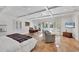 Spacious bedroom with coffered ceilings, tile floors, and french doors to the outside at 4311 Bay Shore Rd, Sarasota, FL 34234