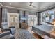 Bright main bedroom with access to balcony, water views, and hardwood floors at 4311 Bay Shore Rd, Sarasota, FL 34234