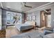 Spacious main bedroom with ocean views, stylish decor, and hardwood floors at 4311 Bay Shore Rd, Sarasota, FL 34234