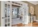 Bright office space with views of the water, a desk, and a mirrored console table at 4311 Bay Shore Rd, Sarasota, FL 34234