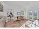 Bright sunroom with French doors, tile floors, and built-in seating at 4311 Bay Shore Rd, Sarasota, FL 34234