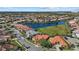 Aerial view of Venezia community, showcasing homes and lake at 4423 Via Del Villetti Dr, Venice, FL 34293