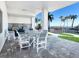 Outdoor kitchen and dining area with ocean views at 4822 Ocean Blvd # 8B, Sarasota, FL 34242