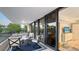 Spacious balcony with seating area, offering relaxing outdoor space at 565 Sanctuary Dr # A203, Longboat Key, FL 34228