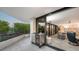 Outdoor balcony with patio furniture and partial water view at 565 Sanctuary Dr # A203, Longboat Key, FL 34228