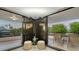 Private balcony with tiled flooring and relaxing seating at 565 Sanctuary Dr # A203, Longboat Key, FL 34228