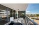 Relaxing balcony with seating and ocean view at 565 Sanctuary Dr # A203, Longboat Key, FL 34228