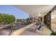 Balcony with lounge chairs and water view at 565 Sanctuary Dr # A203, Longboat Key, FL 34228