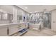Spa-like bathroom with marble shower and soaking tub at 565 Sanctuary Dr # A203, Longboat Key, FL 34228