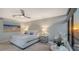 Bright bedroom with a king-size bed and ocean views at 565 Sanctuary Dr # A203, Longboat Key, FL 34228