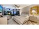 Bright bedroom with large windows, a king-size bed, and plenty of natural light at 565 Sanctuary Dr # A203, Longboat Key, FL 34228