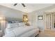 Comfortable bedroom with a king-size bed and plenty of closet space at 565 Sanctuary Dr # A203, Longboat Key, FL 34228