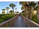 Wooden boardwalk path leading to beach access at 565 Sanctuary Dr # A203, Longboat Key, FL 34228