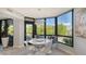 Breakfast nook with window seating and modern dining table at 565 Sanctuary Dr # A203, Longboat Key, FL 34228